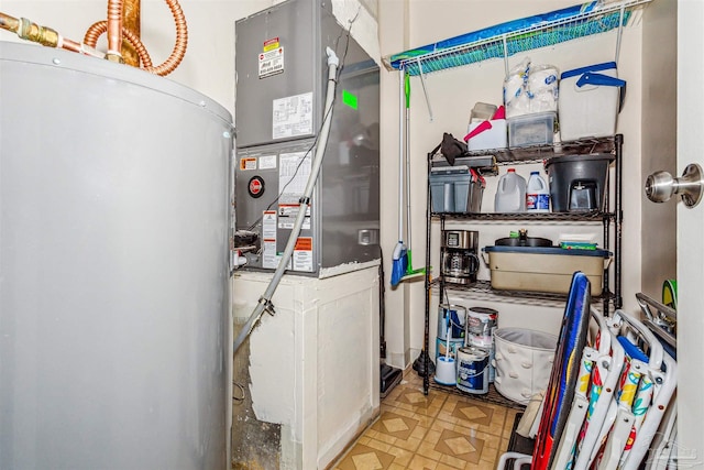 utility room featuring heating unit