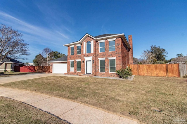 view of front facade with a front yard and a garage