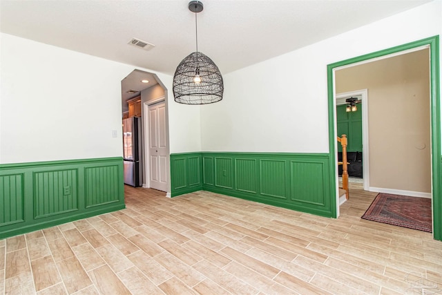 unfurnished room featuring light wood-type flooring