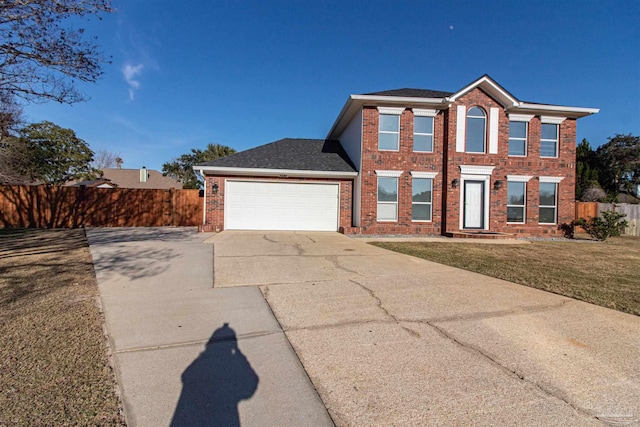 view of front facade with a front lawn and a garage