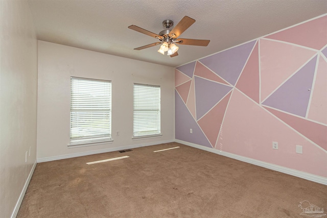 empty room with carpet floors and ceiling fan