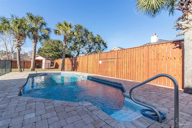 view of swimming pool with a patio