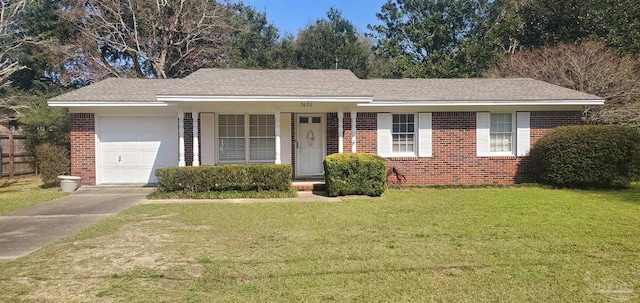 single story home featuring a garage and a front yard