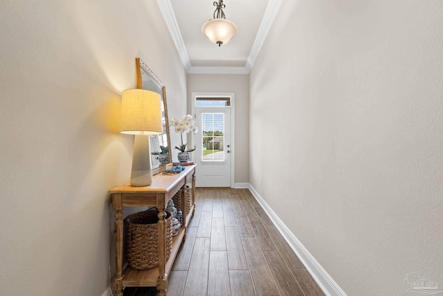 doorway to outside with dark wood-style flooring, baseboards, and ornamental molding