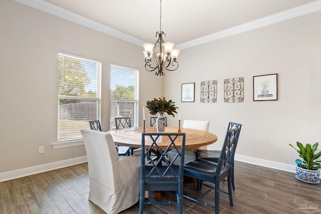 dining area with an inviting chandelier, dark wood-type flooring, baseboards, and crown molding