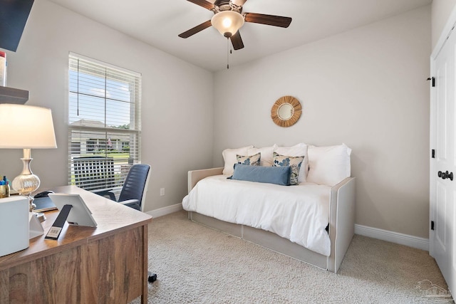 bedroom with baseboards, a ceiling fan, and carpet