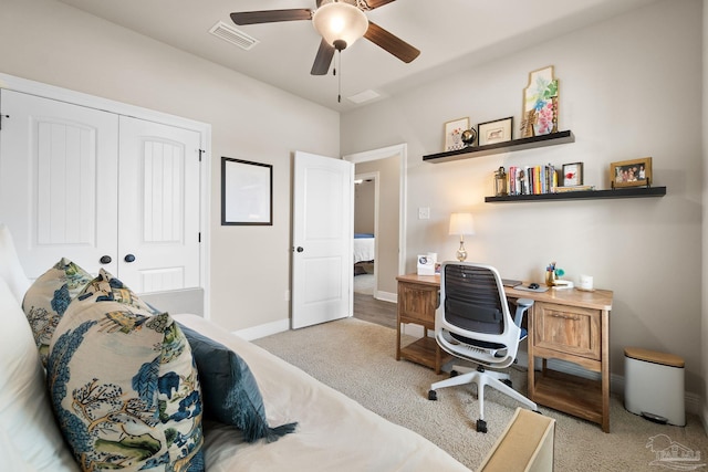 bedroom with light colored carpet, baseboards, visible vents, and a closet
