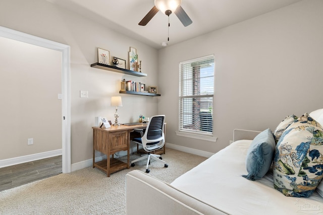carpeted bedroom featuring baseboards and ceiling fan