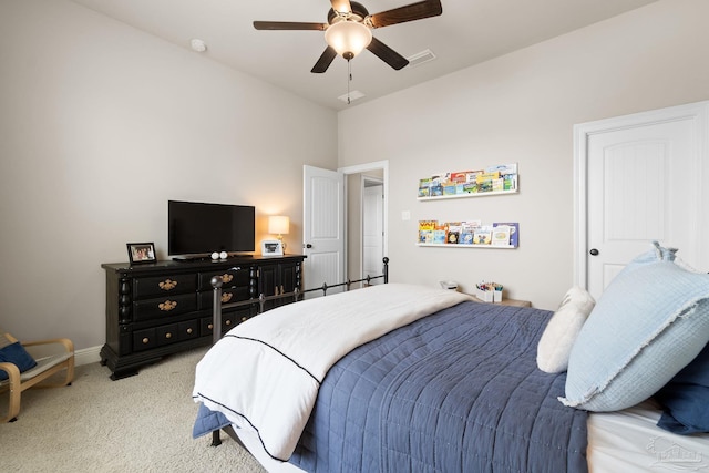 bedroom with visible vents, baseboards, ceiling fan, and light carpet