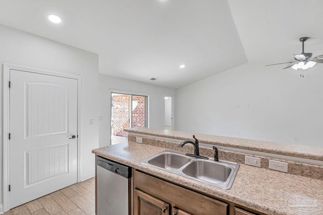 kitchen with sink, vaulted ceiling, light hardwood / wood-style flooring, dishwasher, and ceiling fan