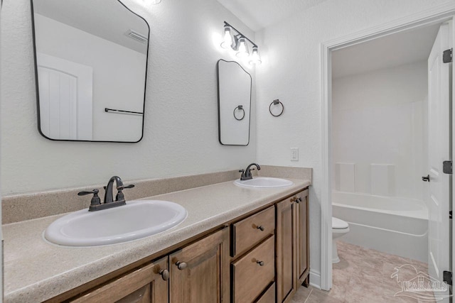 full bathroom with shower / bath combination, vanity, and toilet