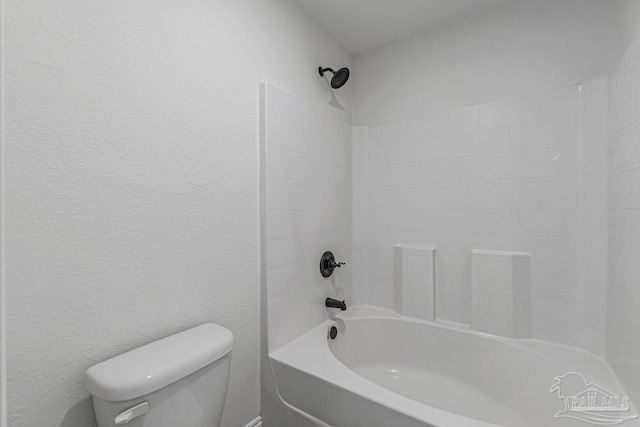 bathroom featuring toilet and shower / bathing tub combination