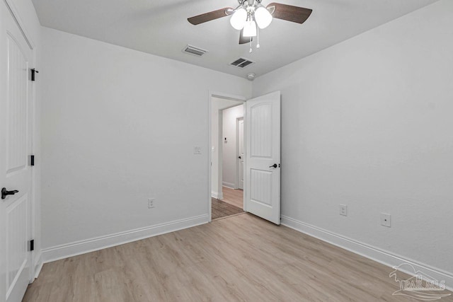 unfurnished bedroom featuring ceiling fan and light wood-type flooring