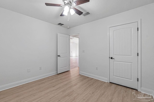 unfurnished bedroom featuring light hardwood / wood-style floors and ceiling fan