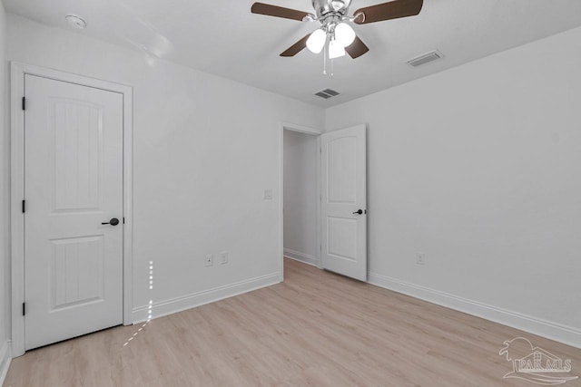 spare room featuring light hardwood / wood-style floors and ceiling fan