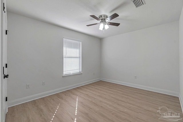 empty room featuring ceiling fan and light hardwood / wood-style flooring