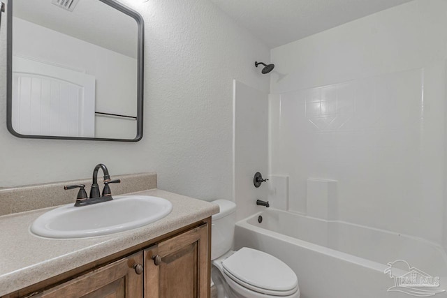 full bathroom featuring bathtub / shower combination, vanity, and toilet