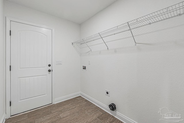 washroom featuring dark hardwood / wood-style floors, hookup for a washing machine, and electric dryer hookup