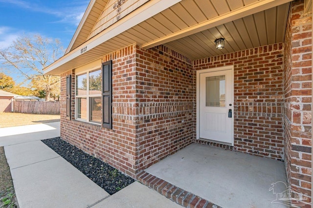 entrance to property featuring a patio