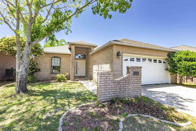 ranch-style home with a garage and a front lawn