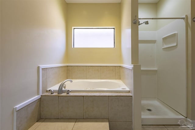 bathroom featuring tile patterned flooring and independent shower and bath