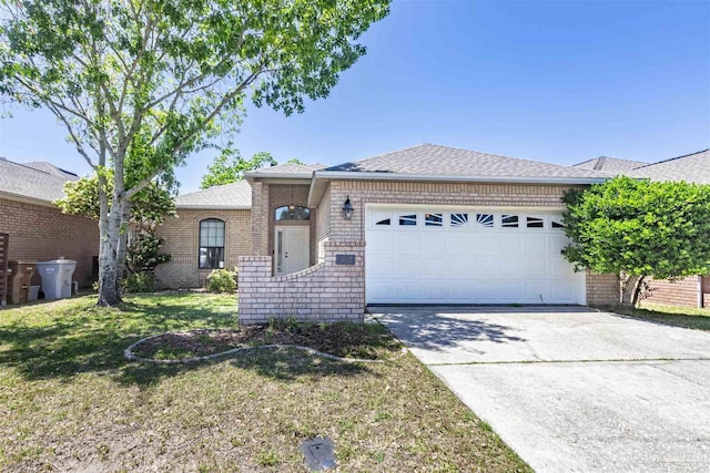 ranch-style house with a garage and a front yard