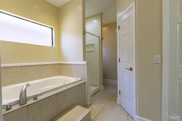 bathroom featuring tile patterned flooring and plus walk in shower