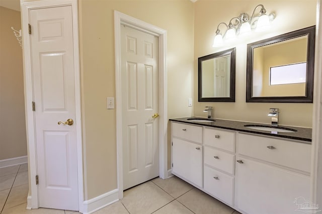 bathroom with vanity and tile patterned flooring