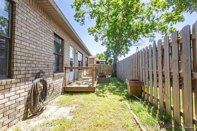 view of yard with a wooden deck