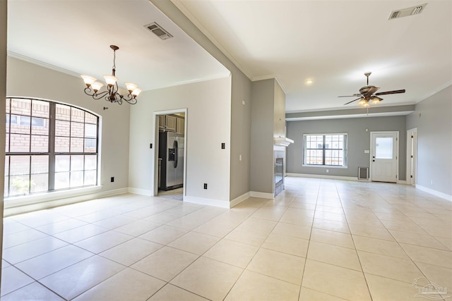 unfurnished room with light tile patterned floors, ceiling fan with notable chandelier, and ornamental molding