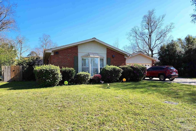 8176 Camelford Dr, Pensacola, FL 32506 - view of home's exterior featuring a yard, fence, and brick siding