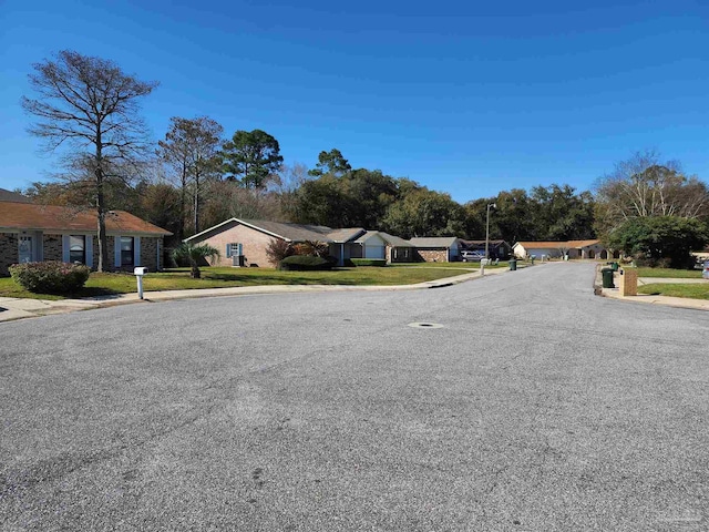 8176 Camelford Dr, Pensacola, FL 32506 - view of road with sidewalks, a residential view, and curbs