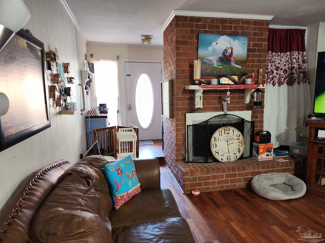 8176 Camelford Dr, Pensacola, FL 32506 - living area featuring ornamental molding, a fireplace, and wood finished floors