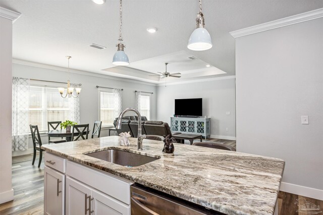 kitchen featuring light stone countertops, sink, and dark hardwood / wood-style flooring