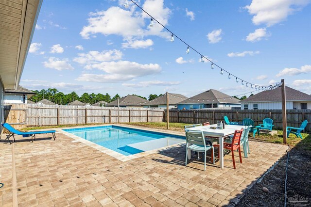 view of swimming pool with a patio