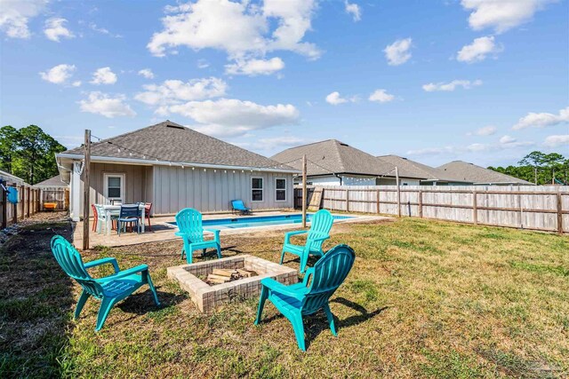 view of yard featuring a patio area and an outdoor fire pit