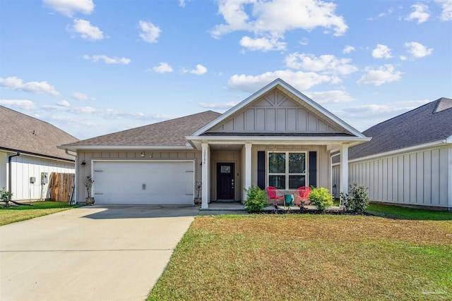 view of front of property featuring driveway, an attached garage, a porch, board and batten siding, and a front yard