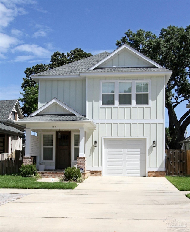 view of front of house with a porch and a garage