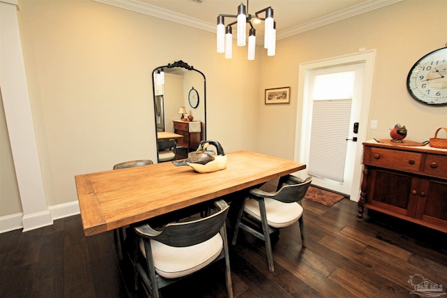 dining room with a notable chandelier, dark hardwood / wood-style floors, and ornamental molding