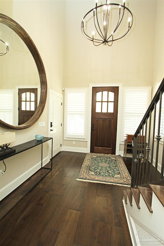 foyer featuring dark hardwood / wood-style flooring and a high ceiling