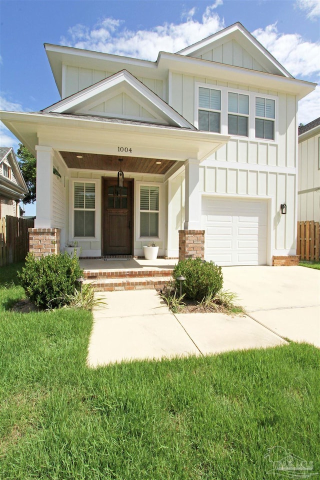 view of front facade featuring covered porch and a garage