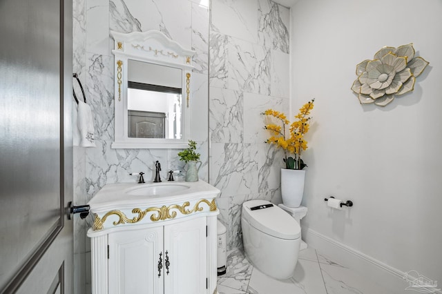 502 Deer Point Dr, Gulf Breeze, FL 32561 - half bathroom featuring marble finish flooring, vanity, toilet, and tile walls