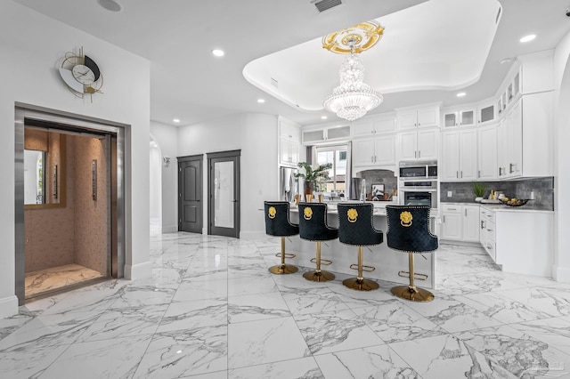 502 Deer Point Dr, Gulf Breeze, FL 32561 - kitchen with appliances with stainless steel finishes, recessed lighting, light marble finish floors, white cabinetry, and tasteful backsplash