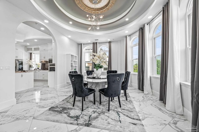 502 Deer Point Dr, Gulf Breeze, FL 32561 - dining area with baseboards, recessed lighting, light marble finish floors, arched walkways, and a chandelier