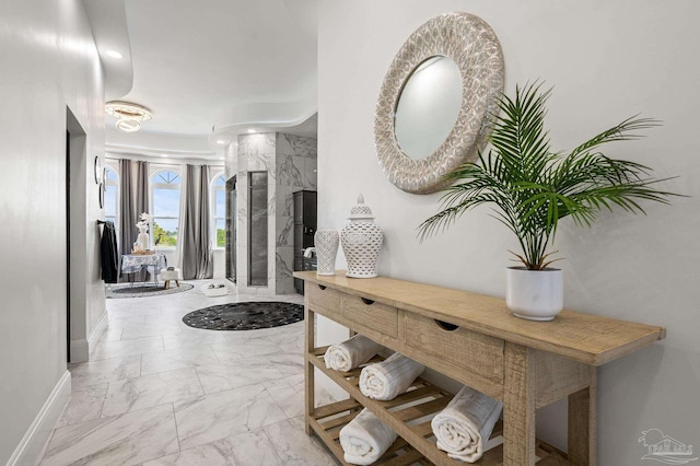 502 Deer Point Dr, Gulf Breeze, FL 32561 - corridor featuring marble look tile flooring and baseboards