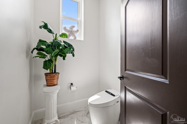 502 Deer Point Dr, Gulf Breeze, FL 32561 - bathroom featuring marble finish floors, baseboards, and toilet