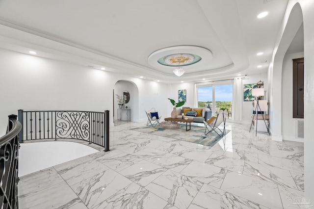 502 Deer Point Dr, Gulf Breeze, FL 32561 - hallway with arched walkways, a raised ceiling, recessed lighting, an upstairs landing, and baseboards
