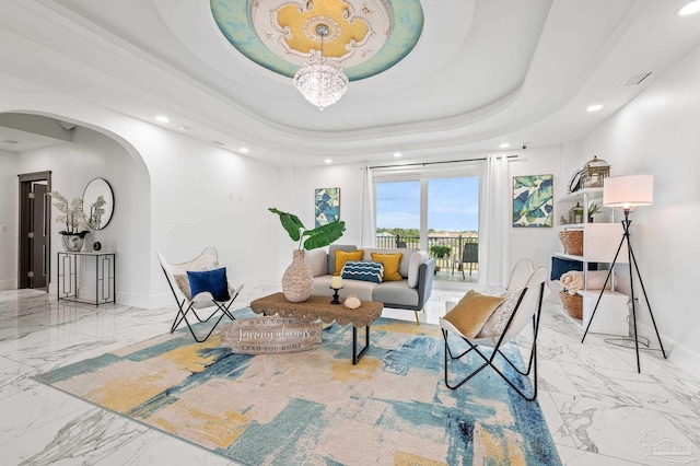 502 Deer Point Dr, Gulf Breeze, FL 32561 - sitting room with arched walkways, marble finish floors, recessed lighting, a tray ceiling, and baseboards