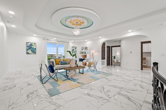 502 Deer Point Dr, Gulf Breeze, FL 32561 - living area featuring arched walkways, baseboards, light marble finish floors, recessed lighting, and a raised ceiling