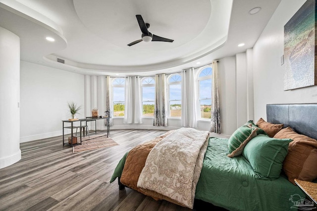502 Deer Point Dr, Gulf Breeze, FL 32561 - bedroom featuring a raised ceiling, recessed lighting, baseboards, wood finished floors, and a ceiling fan